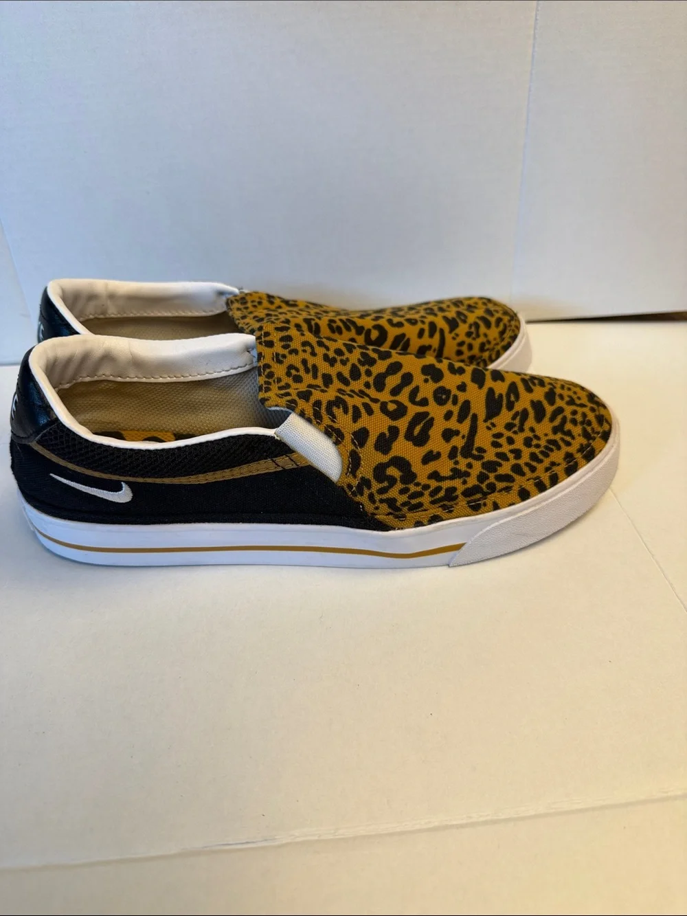 Nike Slip-On Sneakers in Black and Yellow Leopard Print